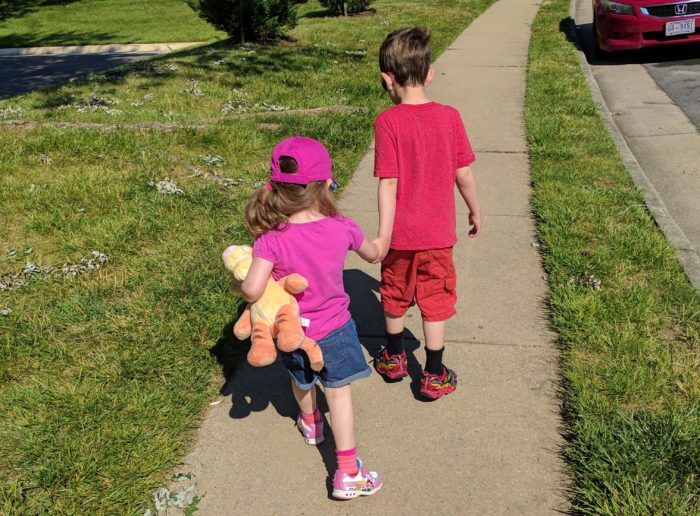 My two kids walking away from the camera